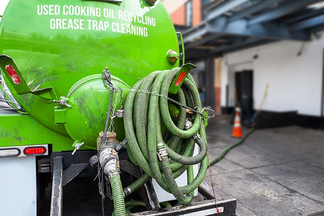 heavy-duty vacuum truck pumping out a grease trap in Big Bend, WI